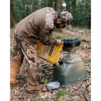 Man filling the 100LB Capsule Feeder