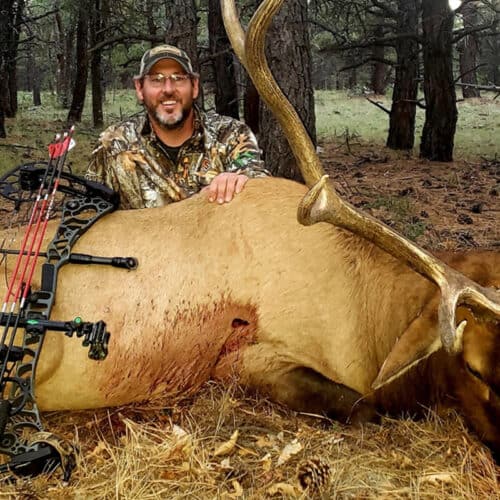 Pro Staff Jason with dead elk and bow